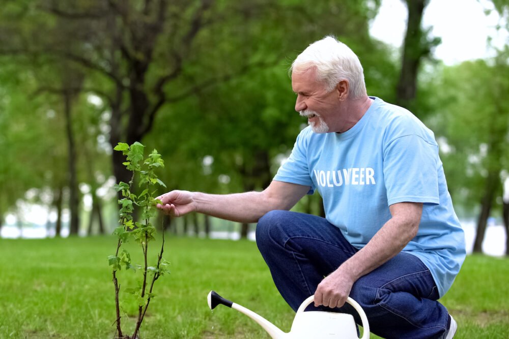 Senior Man Volunteering to Water Trees_The Pavilion Senior Living